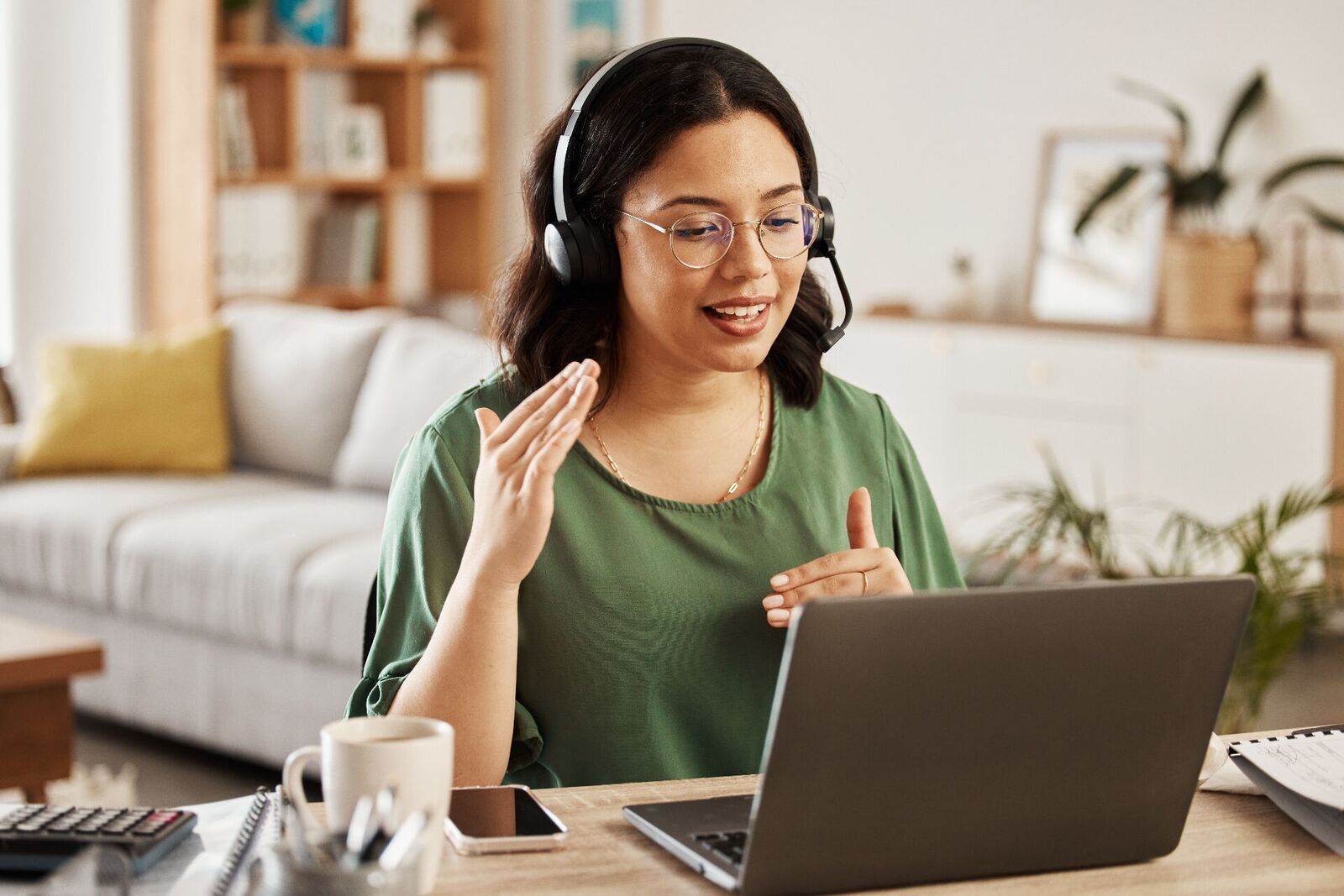 A virtual clinician on a video call from a home office