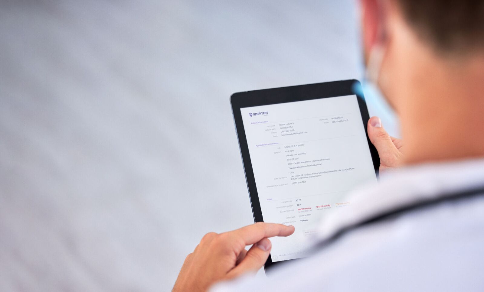 A provider reviewing a Sprinter Health encounter summary on a tablet